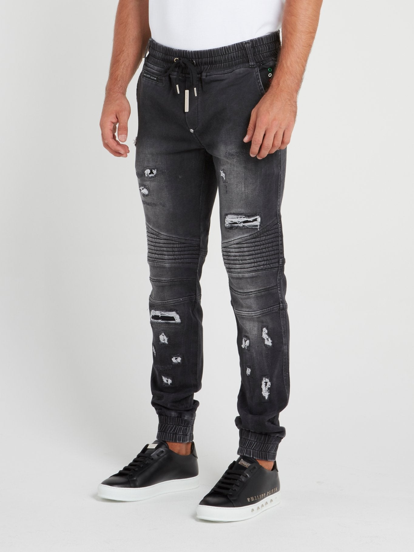 Orders distressed track pants