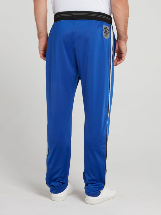 Синие спортивные брюки с лампасами