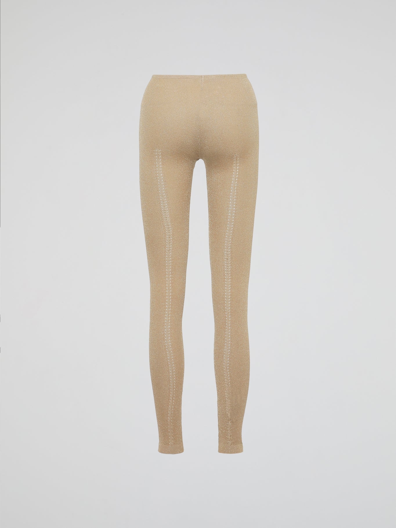 Wrap your legs in luxurious comfort and style with our Beige Knitted Leggings by Roberto Cavalli. Made from the finest quality fabrics, these leggings are expertly designed to provide a seamless fit that sculpts and contours your silhouette flawlessly. Whether you're lounging at home or stepping out for a night on the town, these leggings are the perfect blend of elegance and relaxation.