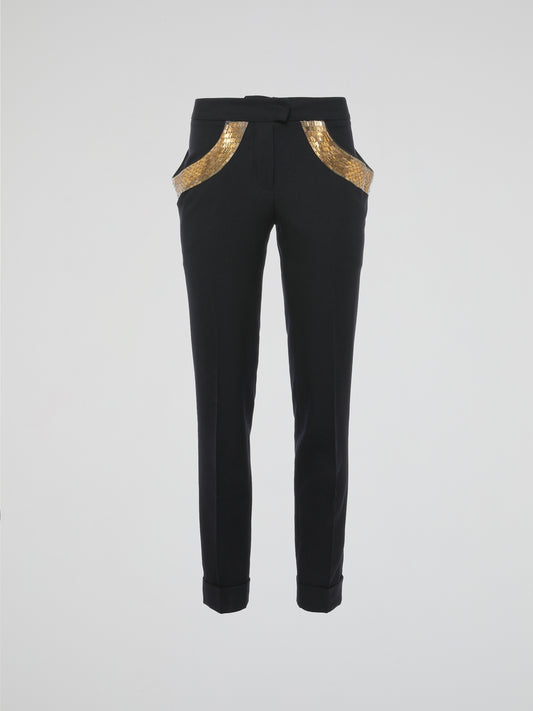 Step into elegance with these stunning Black Embellished Trousers by Roberto Cavalli. Crafted with meticulous care, each detail on these trousers tells a story of sophistication and luxury. From the delicate beaded embellishments to the figure-flattering silhouette, these trousers are a fashion statement that exudes confidence and style.
