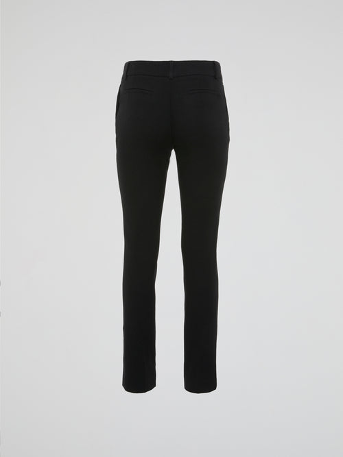 Upgrade your wardrobe with these Black Skinny Trousers by Clas Roberto Cavalli; a fashion statement that effortlessly combines sophistication and comfort. Crafted with precision, these sleek trousers hug your curves and elongate your silhouette, while the rich black color adds a touch of elegance to any outfit. Whether for a formal event or a casual night out, Cavalli's iconic design will ensure you turn heads wherever you go.