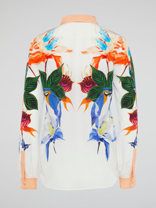 Embrace your inner wildflower with this stunning Flora Print Blouse by Roberto Cavalli. Let the vibrant colors and intricate floral pattern transport you to a lush garden of style and sophistication. Elevate your wardrobe and turn heads wherever you go in this uniquely beautiful piece.
