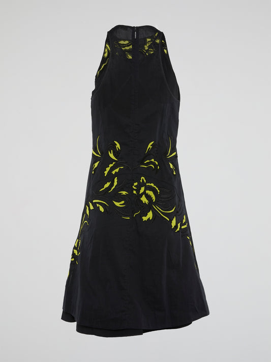 Be the epitome of elegance and sophistication in this stunning black embroidered shift dress by Roberto Cavalli. The intricate floral detailing and sleek silhouette make this piece a must-have for any fashion-forward individual. Turn heads and make a bold statement at your next event with this show-stopping dress that exudes luxury and style.