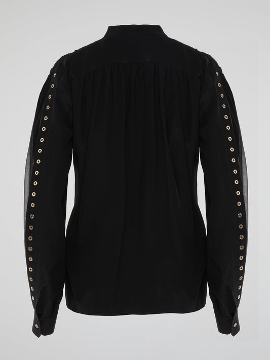 Elevate your wardrobe with the stunning Black Button Embellished Blouse by Roberto Cavalli. With intricate detailing and luxurious fabric, this blouse exudes sophistication and glamour. Embrace your fierce and fearless side in this statement piece that is sure to turn heads wherever you go.