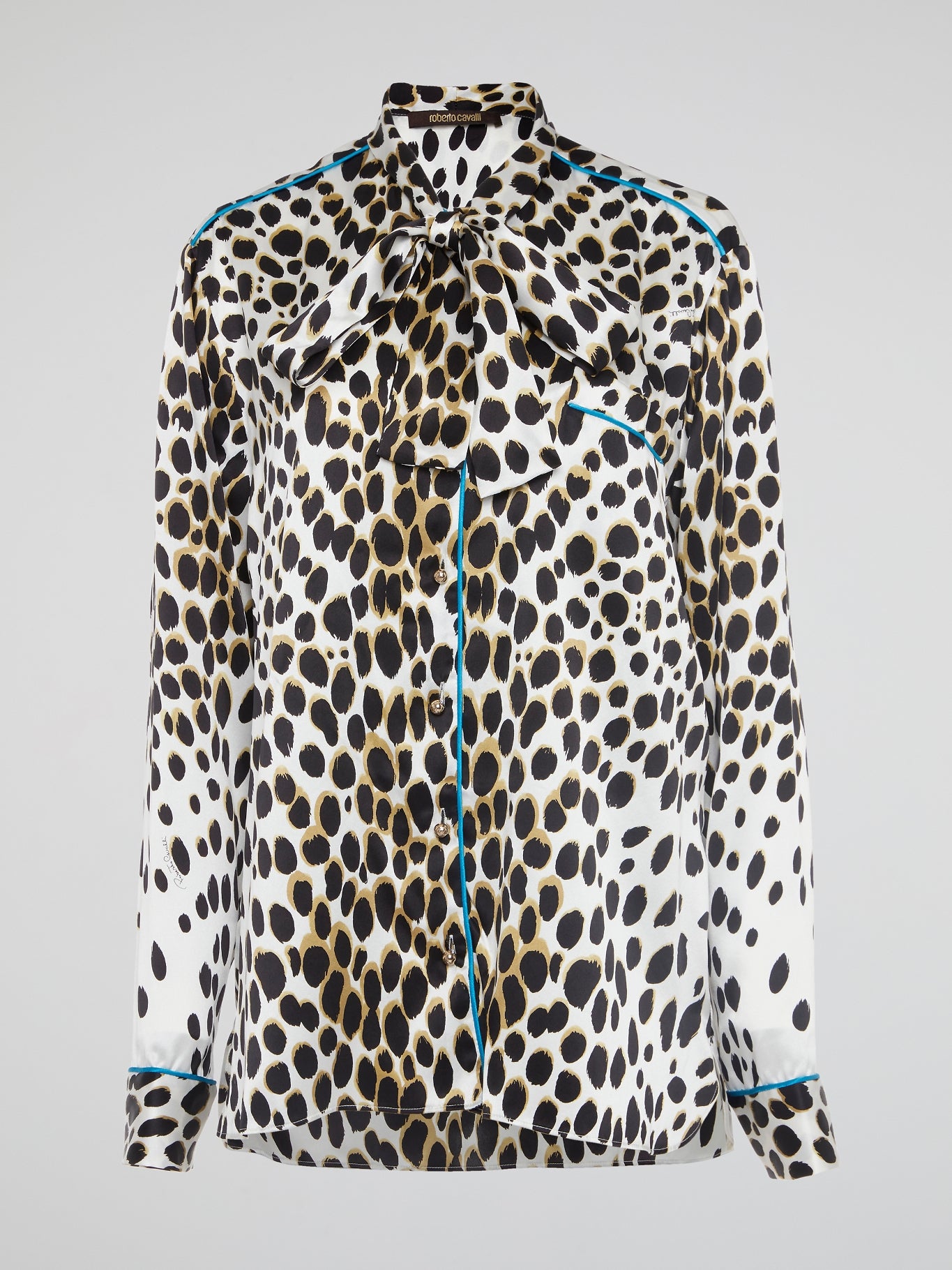 Unleash your wild side with this fierce Leopard Print Bow Tie Blouse by Roberto Cavalli. Embrace your inner fashionista with this bold statement piece that is sure to turn heads wherever you go. Add a touch of glamour and sophistication to your wardrobe with this unique and trendy top that exudes confidence and style.