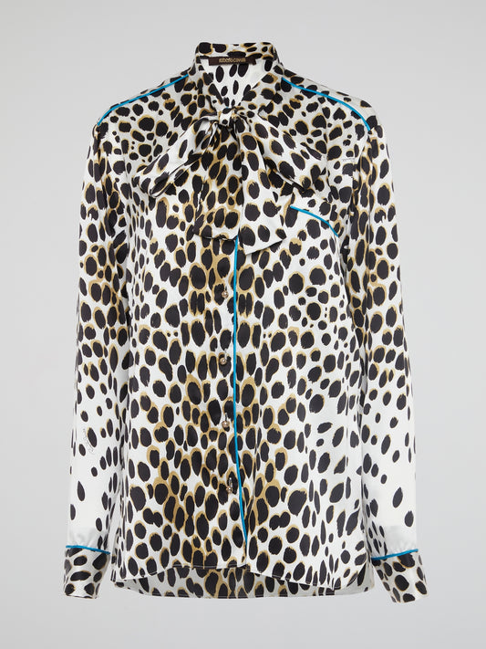 Unleash your wild side with this fierce Leopard Print Bow Tie Blouse by Roberto Cavalli. Embrace your inner fashionista with this bold statement piece that is sure to turn heads wherever you go. Add a touch of glamour and sophistication to your wardrobe with this unique and trendy top that exudes confidence and style.