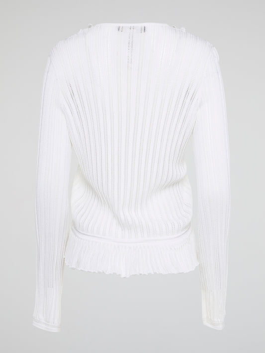 Elevate your wardrobe with the White Rib Knit Long Sleeve Top from Roberto Cavalli. Crafted with luxurious ribbed fabric, this top boasts a flattering silhouette and a timeless white hue perfect for any occasion. Embrace effortless elegance and make a statement with this must-have wardrobe staple.