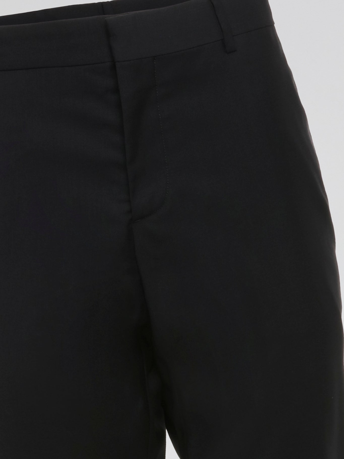 Elevate your wardrobe with these sleek and sophisticated Black High Waist Suit Pants by Roberto Cavalli. Crafted with meticulous attention to detail, these pants feature a flattering high waist design that elongates your silhouette. Whether styled with a crisp white shirt for the office or a statement blouse for a night out, these pants are sure to turn heads wherever you go.