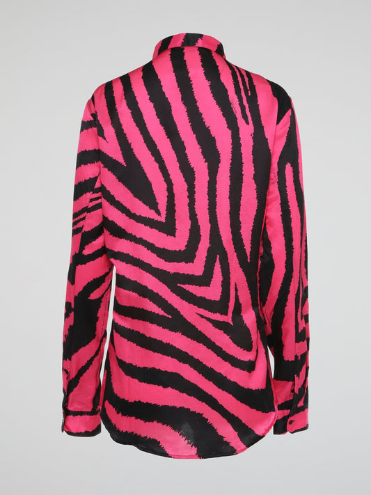 Let your wild side shine with this stunning Pink Zebra Print Shirt by Roberto Cavalli, crafted for the fashion-forward individual who dares to stand out from the crowd. Made with luxurious materials and impeccable attention to detail, this shirt is a bold statement piece that exudes confidence and style. Embrace your inner fashionista and make heads turn wherever you go with this eye-catching and trendy wardrobe essential.