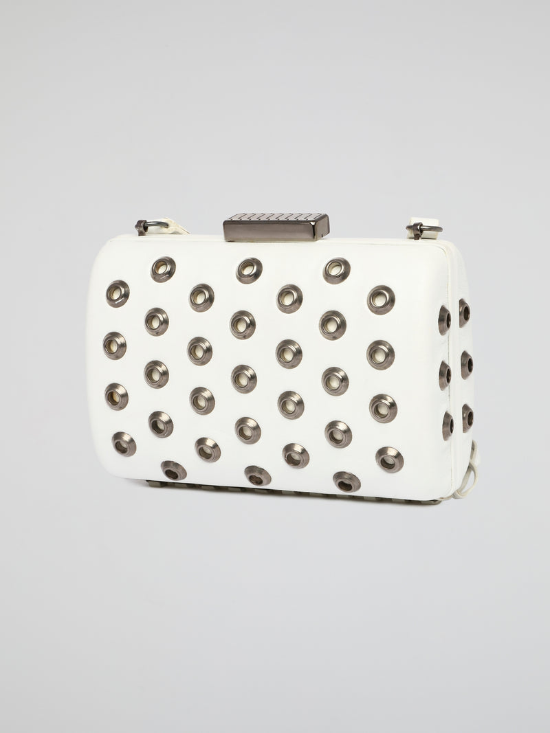 Elevate your accessory game with this stunning white embellished leather clutch by Roberto Cavalli. The intricate detailing and luxurious material make it a standout piece for any special occasion or night out. Make a bold statement and turn heads wherever you go with this elegant and chic clutch in hand.