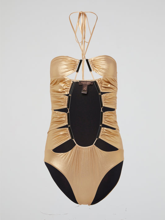 Indulge in luxury with our stunning Gold Halter Neck Swimwear by Roberto Cavalli, guaranteed to turn heads at the beach or by the pool. The shiny metallic fabric and eye-catching halter neckline ensure you stand out from the crowd in style. Elevate your swimwear collection with this glamorous piece that exudes confidence and sophistication.
