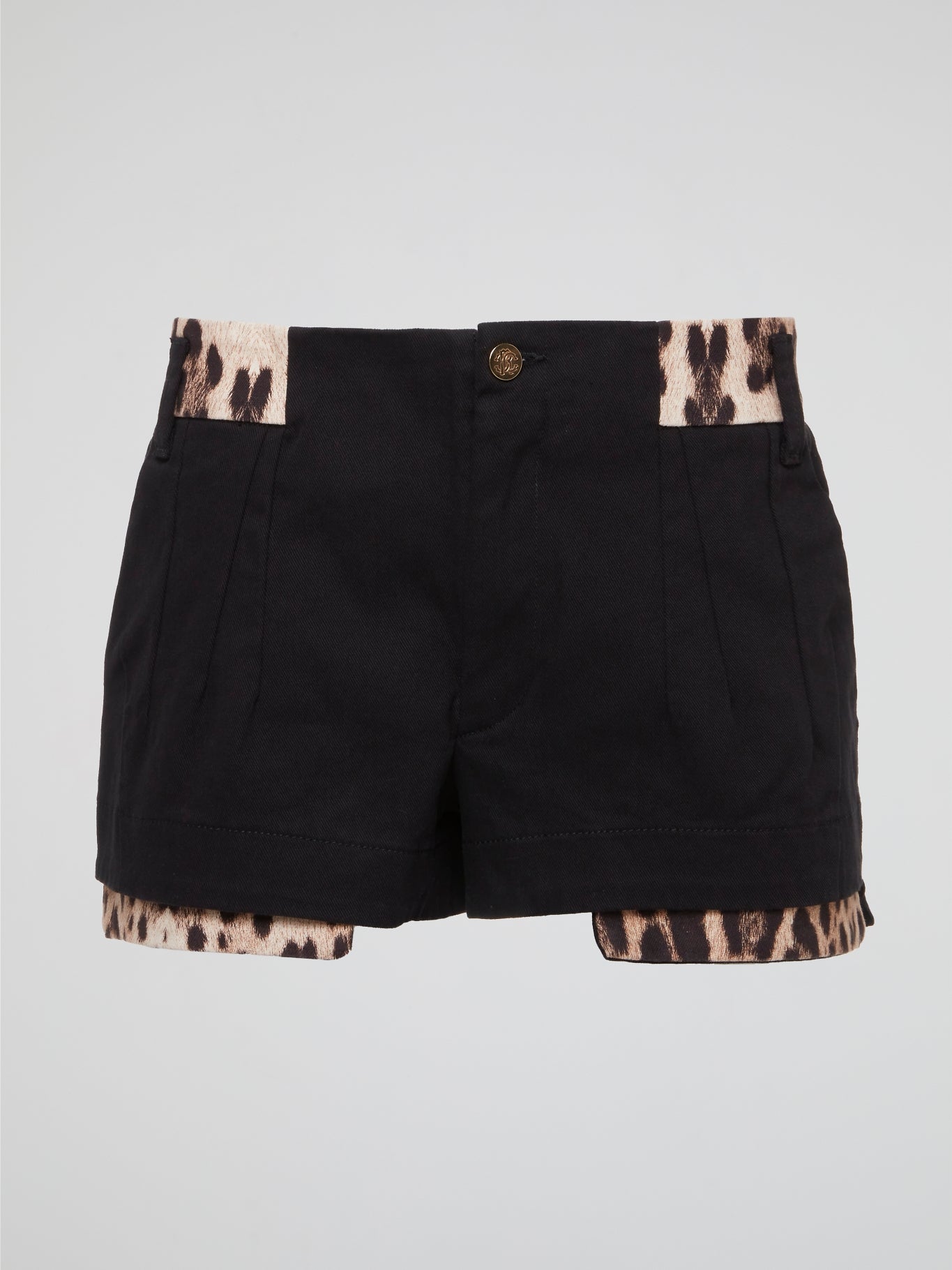 Unleash your inner wild side with these fierce Black Leopard Trim Shorts by Roberto Cavalli. Made for the fashion-forward individual who isn't afraid to stand out in a crowd, these shorts feature a bold leopard print trim that adds a touch of edgy sophistication to any outfit. Whether you're hitting the town or lounging at home, these shorts are sure to turn heads and make a statement wherever you go.