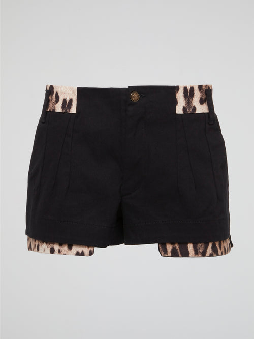 Unleash your inner wild side with these fierce Black Leopard Trim Shorts by Roberto Cavalli. Made for the fashion-forward individual who isn't afraid to stand out in a crowd, these shorts feature a bold leopard print trim that adds a touch of edgy sophistication to any outfit. Whether you're hitting the town or lounging at home, these shorts are sure to turn heads and make a statement wherever you go.