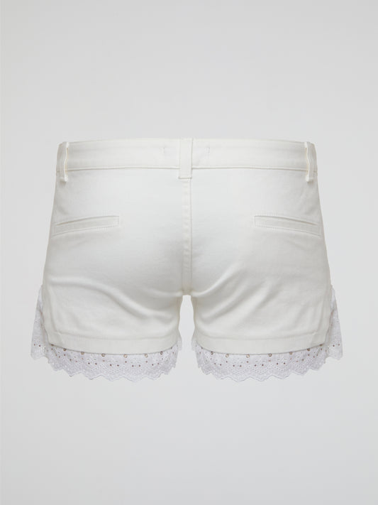 Embrace your inner bohemian goddess with these White Lace Trim Shorts by Roberto Cavalli. The delicate lace detailing adds a touch of elegance to these flowy shorts, perfect for a summer music festival or beach day. Channel your inner free spirit and stand out in style with this must-have addition to your wardrobe.