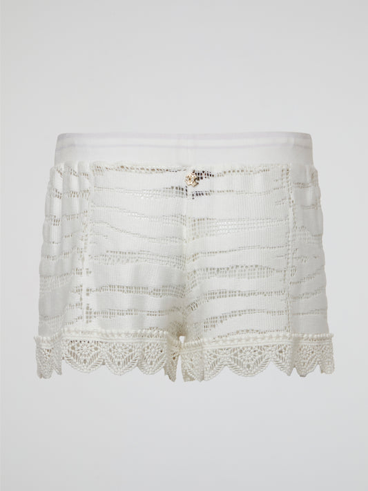 Elevate your summer wardrobe with these stunning white knitted shorts by Roberto Cavalli, perfect for lounging by the pool or a chic brunch with friends. Crafted with impeccable attention to detail, these shorts effortlessly blend comfort and style for a truly luxurious feel. Embrace your inner fashionista and make a statement with these must-have shorts that are sure to turn heads wherever you go.