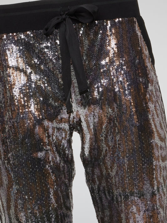 Feel fierce and fabulous in our Leopard Pattern Sequin Pants from Roberto Cavalli. These statement-making bottoms are sure to turn heads wherever you go, with their bold leopard print and shimmering sequins. Channel your inner wild side and stand out from the crowd in these show-stopping pants.