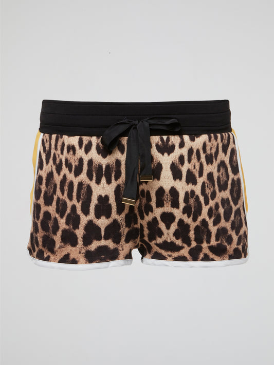 Unleash your wild side with these leopard print drawstring shorts by Roberto Cavalli. Perfect for adding a touch of high-end luxury to your casual summer wardrobe, these shorts are a statement piece that will turn heads wherever you go. Embrace your inner fashionista and stand out from the crowd with these fiercely fabulous shorts.