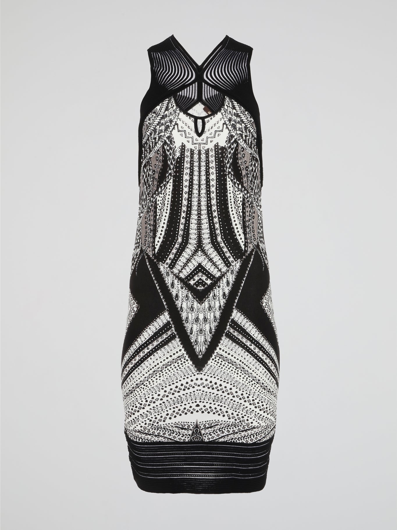 This Tribal Print Sleeveless Dress by Roberto Cavalli merges the wild spirit of nature with the elegance of high fashion. Its vibrant and intricate tribal patterns transport you to faraway lands, while the sleek and effortless silhouette ensures a showstopper look. Indulge in this masterpiece that captures the essence of adventure and sophistication in every stitch.