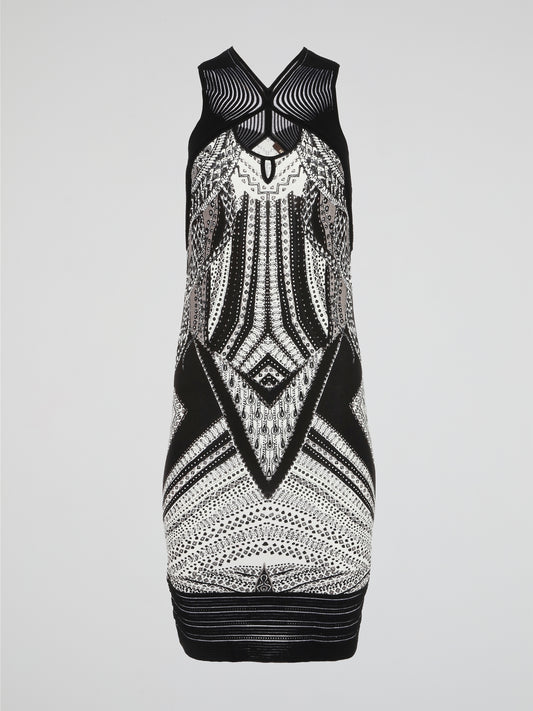 This Tribal Print Sleeveless Dress by Roberto Cavalli merges the wild spirit of nature with the elegance of high fashion. Its vibrant and intricate tribal patterns transport you to faraway lands, while the sleek and effortless silhouette ensures a showstopper look. Indulge in this masterpiece that captures the essence of adventure and sophistication in every stitch.