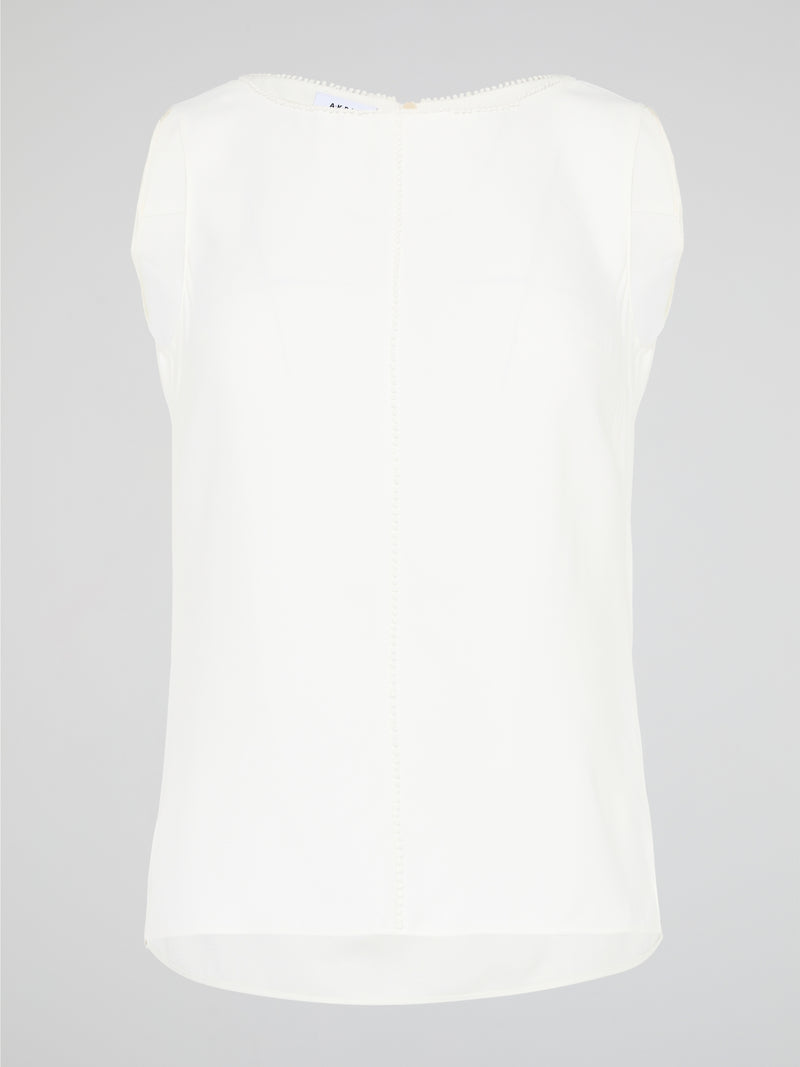 Introducing a timeless masterpiece for fashion-forward mavens - the White Sleeveless Top by Akris Punto. This ethereal beauty effortlessly combines sophistication and elegance with its minimalist design and impeccable tailoring. Crafted from luxurious fabrics, it's the perfect versatile piece to elevate your style, ensuring you're the epitome of chic from desk to dinner.