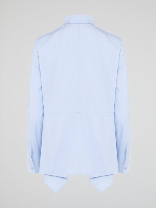 Introducing the Powder Blue High-Low Shirt by Akris Punto, where elegance meets contemporary style. Delicate powder blue hue cascades down the front, enveloping you in a calming wave of tranquility. With its unique high-low hemline and luxurious fabric, this shirt effortlessly elevates any outfit, making it a must-have piece for the fashion-forward trendsetters.