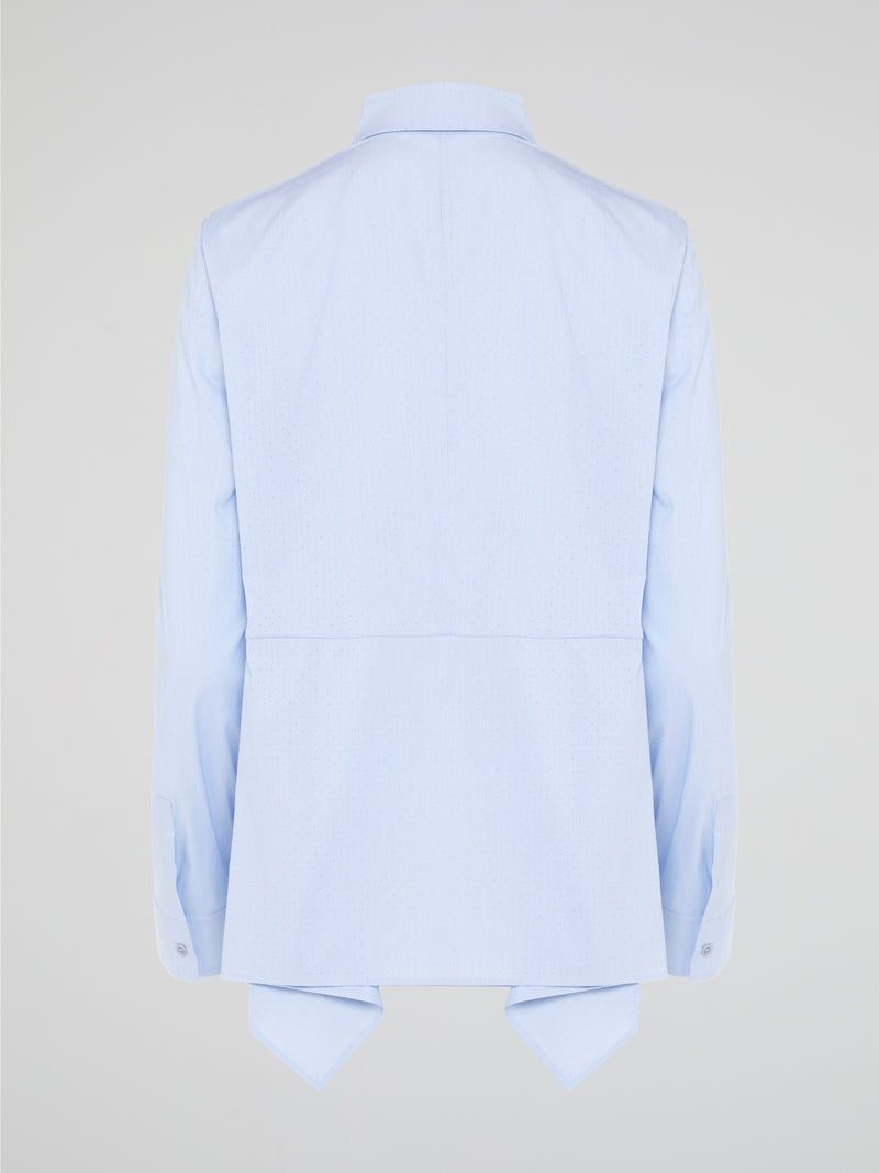 Introducing the Powder Blue High-Low Shirt by Akris Punto, where elegance meets contemporary style. Delicate powder blue hue cascades down the front, enveloping you in a calming wave of tranquility. With its unique high-low hemline and luxurious fabric, this shirt effortlessly elevates any outfit, making it a must-have piece for the fashion-forward trendsetters.
