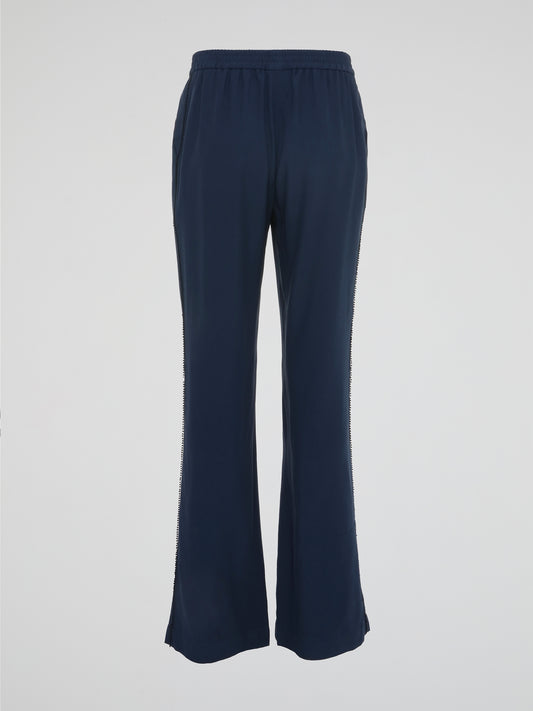 Step into sophisticated style with the Navy Flared Trousers by Akris Punto. Crafted with precision, these pants gracefully hug your curves before flaring out at the hemline, creating an effortlessly elegant silhouette. Pair them with a blouse for a professional look or dress them up with a sleek blazer for a night out on the town.