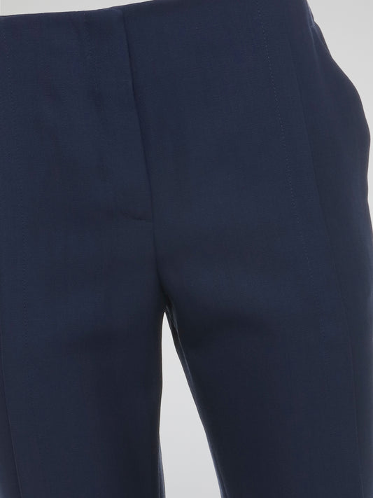 Step up your style game with the Navy High Waist Trousers from Akris Punto! These uber-chic trousers boast a flattering high waist design, perfectly enhancing your silhouette and giving you that extra boost of confidence. Whether you're strutting into the office or heading out for a night on the town, these trousers effortlessly combine elegance with comfort for a look that's both sophisticated and trendy.