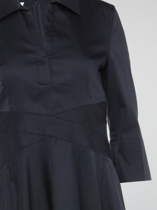 The Navy Shirt Dress by Akris Punto is the epitome of effortless elegance. Crafted from luxurious navy fabric, this dress effortlessly combines sophistication and comfort. Its tailored silhouette, adorned with a delicate lace trim, transforms any occasion into a stylish affair.