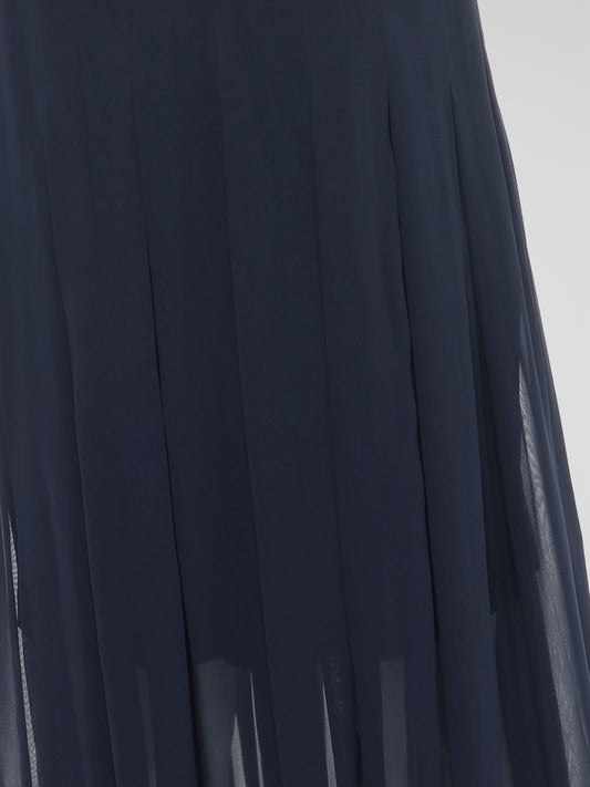 Step into elegance and grace with our Navy Pleated Maxi Dress from Akris Punto. Crafted with meticulous attention to detail, this dress showcases a flattering pleated design that beautifully flows with every step. Perfect for both formal occasions and casual outings, it's time to make a statement and be the epitome of sophistication.