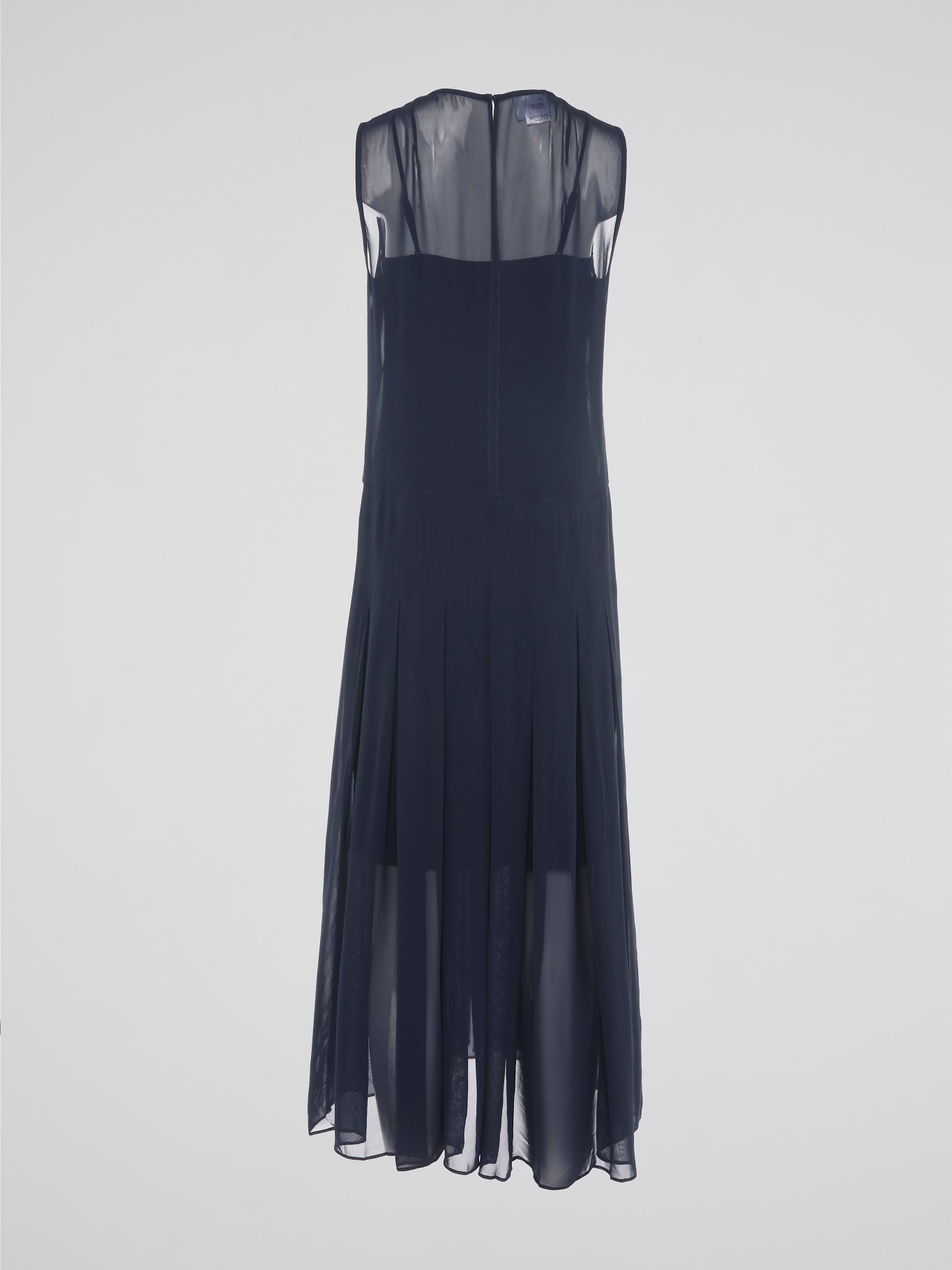 Step into elegance and grace with our Navy Pleated Maxi Dress from Akris Punto. Crafted with meticulous attention to detail, this dress showcases a flattering pleated design that beautifully flows with every step. Perfect for both formal occasions and casual outings, it's time to make a statement and be the epitome of sophistication.