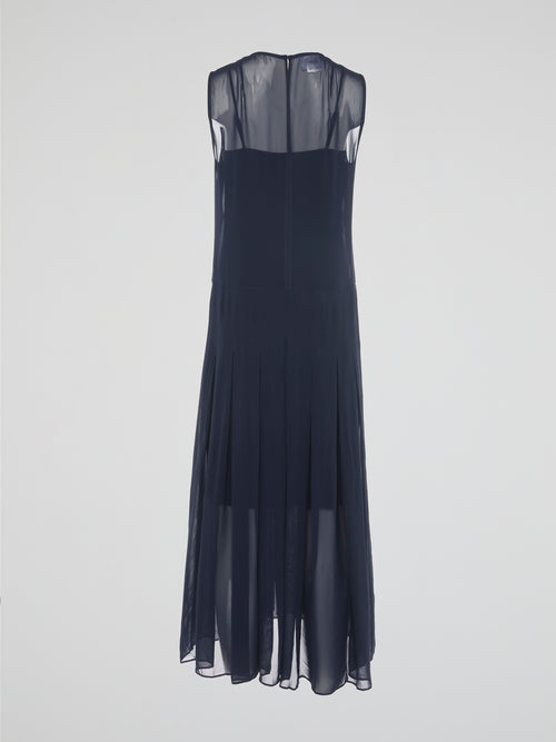 Step into elegance and grace with our Navy Pleated Maxi Dress from Akris Punto. Crafted with meticulous attention to detail, this dress showcases a flattering pleated design that beautifully flows with every step. Perfect for both formal occasions and casual outings, it's time to make a statement and be the epitome of sophistication.