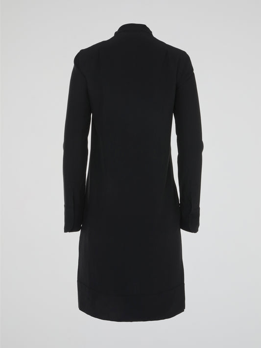 Unleash your inner fashion maven with our Black Embellished Shirt Dress by Akris Punto. This captivating dress fuses sophistication and edge, featuring intricate embellishments that add a touch of glamour to your ensemble. Its timeless silhouette ensures that you'll make a lasting impression at any event, making it a must-have for the style-conscious woman.