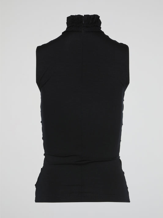 The Black High Neck Tiered Top by Akris Punto perfectly combines elegance and modernity in one stunning piece. With its high neckline and tiered design, this top effortlessly adds depth and movement to any ensemble. Whether paired with trousers for a chic office look or dressed up with a statement skirt for a special evening event, this top is a must-have addition to your wardrobe.