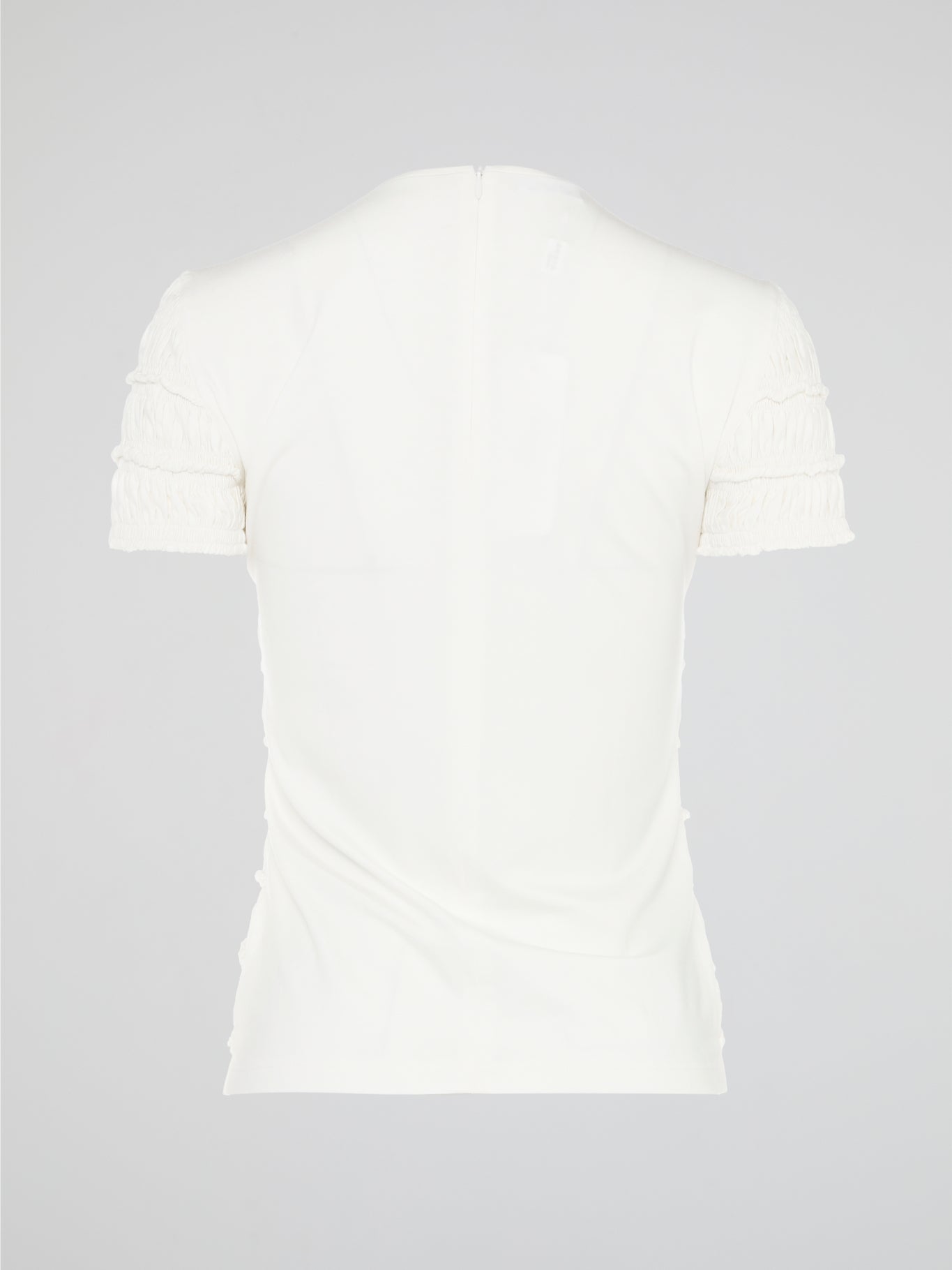 The White Tiered Top from Akris Punto is a captivating blend of sophistication and whimsy. With its unique tiered design, this versatile top adds a playful twist to any outfit. Made from premium materials, it effortlessly drapes to flatter your figure and is perfect for both casual and formal occasions.