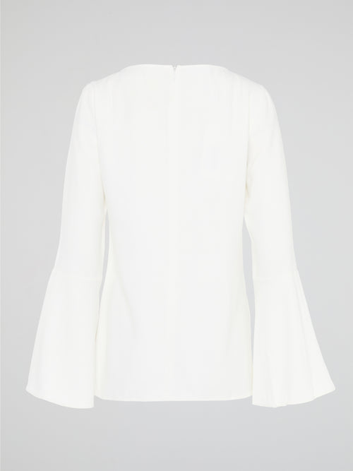 Elevate your everyday look with the White Flared Sleeve Top by Akris Punto. This contemporary and chic piece features unique flared sleeves that add a playful twist to your outfit. Made with high-quality materials, this top guarantees comfort and style, making it a must-have addition to your wardrobe.