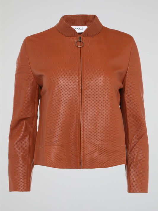 Step into the world of effortlessly cool style with our Orange Perforated Bomber Jacket by Akris Punto. Crafted with meticulous attention to detail, this vibrant piece seamlessly blends the classic bomber silhouette with modern perforated fabric for a unique twist. Whether you're exploring the city or hitting the dance floor, make a bold statement and exude confidence with this must-have jacket.