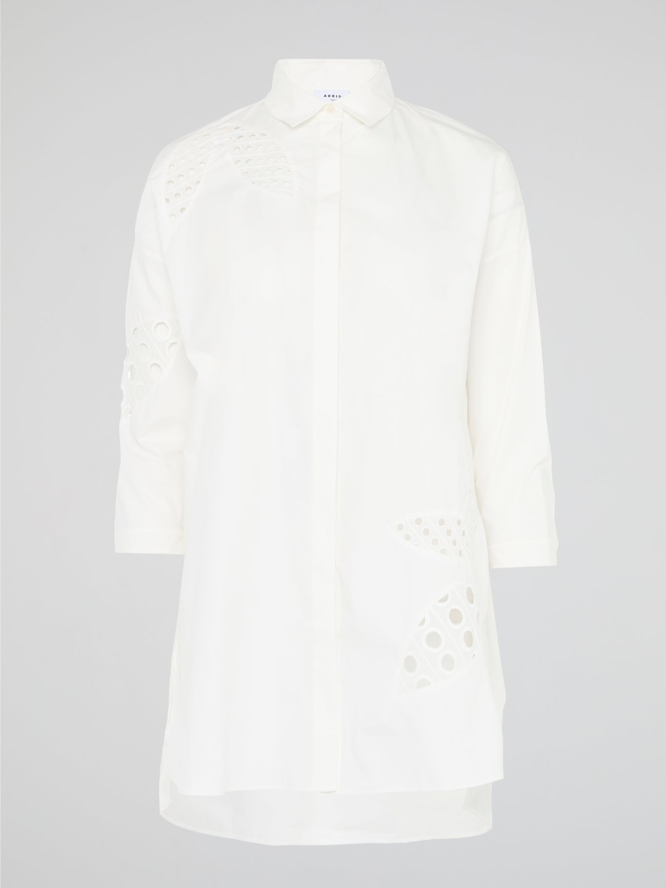 Captivating and versatile, the White Shirt Dress by Akris Punto is a sartorial masterpiece that effortlessly balances elegance and comfort. Its clean lines and crisp white hue exude sophistication, while the relaxed fit and luxurious fabric ensure day-to-night wearability. Whether paired with heels for an evening out or styled with sneakers for a casual brunch, this dress is the epitome of timeless chic.
