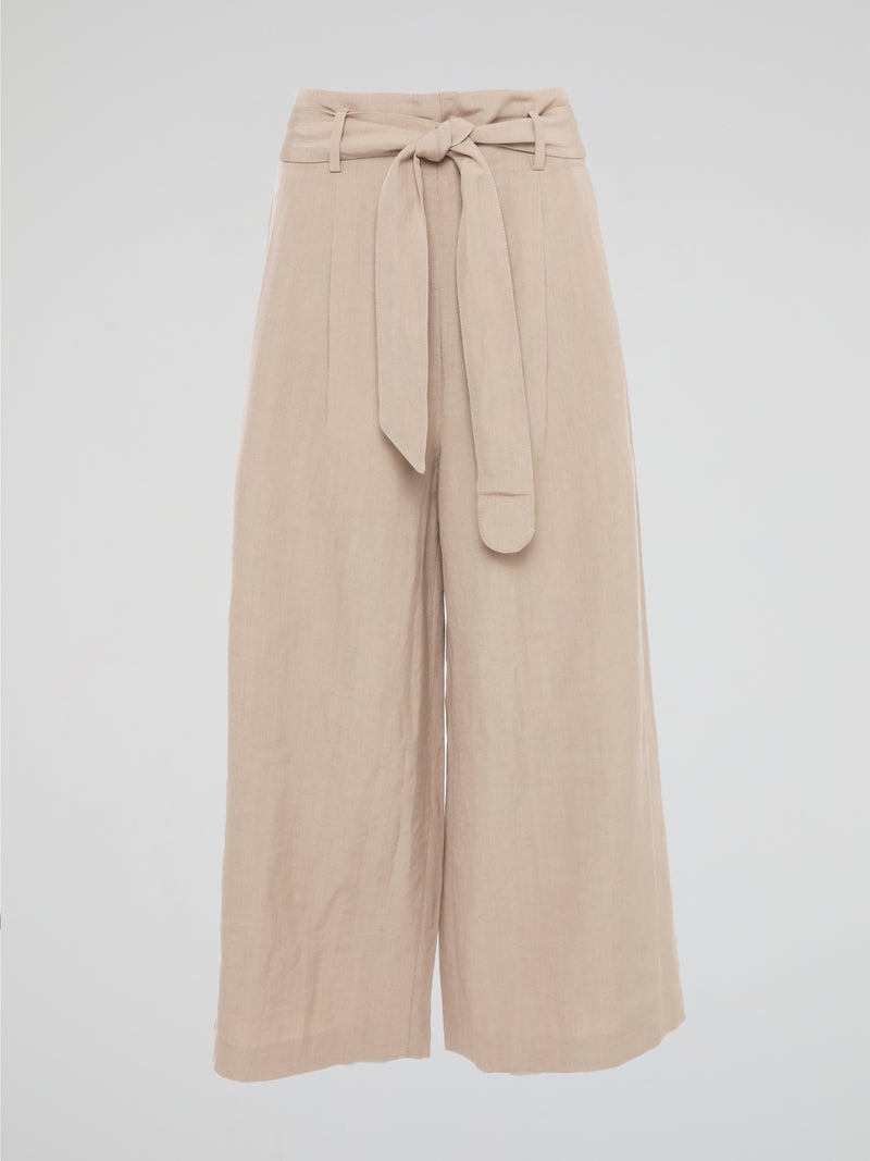 Elevate your style game with these Beige Belted Palazzo Pants from Akris Punto. Crafted with meticulous attention to detail, these pants feature a high-waisted, wide-leg silhouette that flatters every body type. The chic belted waist adds a touch of sophistication, making these pants the perfect choice for a day at the office or a stylish evening event.