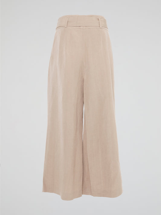 Elevate your style game with these Beige Belted Palazzo Pants from Akris Punto. Crafted with meticulous attention to detail, these pants feature a high-waisted, wide-leg silhouette that flatters every body type. The chic belted waist adds a touch of sophistication, making these pants the perfect choice for a day at the office or a stylish evening event.
