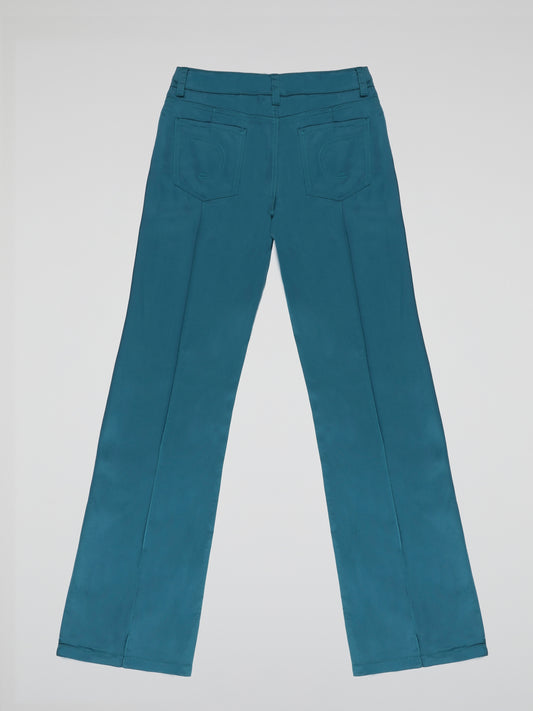 Get ready to turn heads with these Teal Wide Leg Pants by Clas Roberto Cavalli! The vibrant teal color adds an element of boldness to your outfit, while the wide leg design effortlessly exudes a chic and sophisticated vibe. Crafted with the utmost attention to detail, these pants ensure both comfort and style, perfect for any occasion.