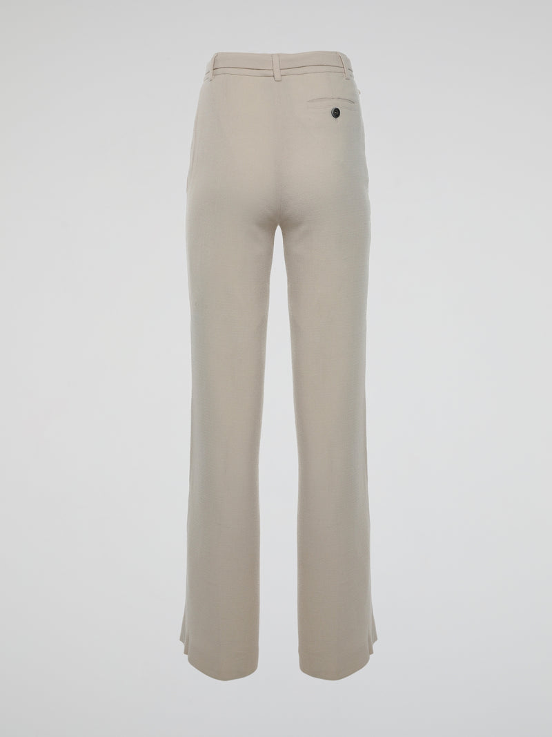 Step into the world of elegance and sophistication with Roberto Cavalli's Beige Flared Trousers. Crafted with utmost care and precision, these trousers seamlessly blend comfort and style, elevating your fashion game to new heights. Boasting a flattering flared design and a versatile beige hue, these trousers are perfect for both casual outings and formal occasions, making you the epitome of refined fashion wherever you go.