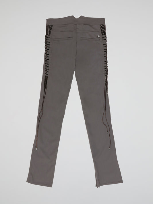 Step up your style game with these Grey Embellished Trousers from Roberto Cavalli - a perfect blend of elegance and edginess. The intricate embellishments add a touch of glamour to the classic grey hue, while the tailored fit ensures a flattering silhouette. Whether it's a formal event or a night out on the town, these trousers are sure to make a statement and leave a lasting impression.