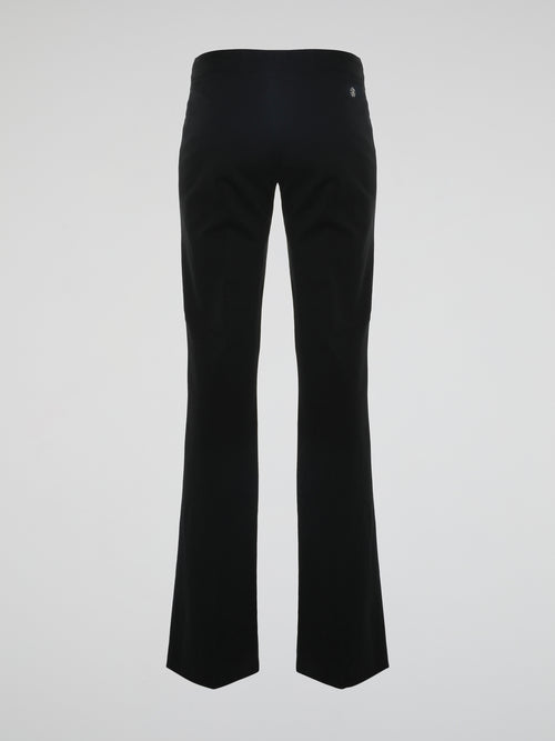 Step into the world of effortless glamour with these Black Flared Trousers by Roberto Cavalli. Crafted with meticulous precision, these trousers boast a striking silhouette that elegantly skims the figure, accentuating every curve. From the office to a night out, these trousers are a timeless wardrobe staple designed to make a bold fashion statement.