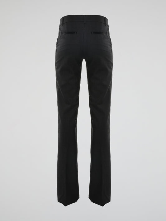 Step out in style and make heads turn with these stunning Black Flared Pants by Roberto Cavalli. Crafted with impeccable precision, these pants exude timeless elegance and are perfect for any occasion. With their flattering fit and luxurious fabric, they effortlessly combine sophistication and comfort, elevating your fashion game to new heights.