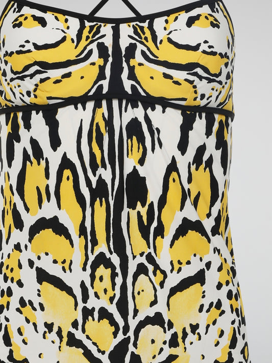 Introducing the Yellow Printed Strap Dress by Roberto Cavalli, where elegance meets vibrant playfulness. This enchanting masterpiece features a luxurious silky fabric adorned with a captivating pattern of intricate yellow hues, perfect for making a statement at any event. With its flattering silhouette and delicate straps, this dress effortlessly embodies the essence of modern glamour, promising to leave a lasting impression wherever you go.