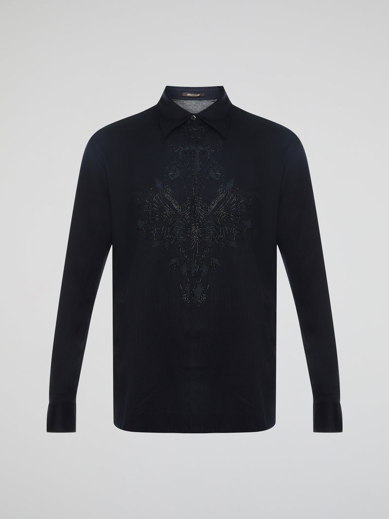 Step into the realm of effortless elegance with the captivating Black Embroidered Shirt by Roberto Cavalli. Adorned with intricate embroidery and delicate lace details, this shirt is a mesmerizing fusion of sophistication and sensuality. Elevate your style with this statement piece that exudes an air of mystique and timeless allure.
