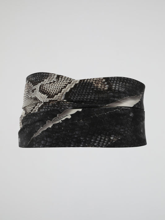 Add a touch of fierce elegance to your outfits with the mesmerizing Snake Print Belt from Roberto Cavalli. Crafted with meticulous attention to detail, this accessory combines edginess and sophistication effortlessly. Let the hypnotic pattern wrap around your waist, instantly transforming any ensemble into a show-stopping masterpiece.