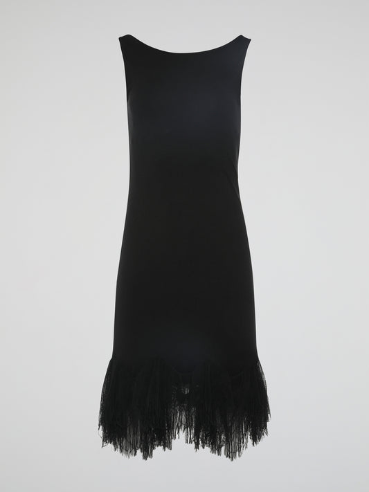 Introducing the epitome of elegance and glamour – the Black Fringe Hem Dress by Roberto Cavalli. This show-stopping piece combines the timeless sophistication of a little black dress with the playful flair of fringed details. With its figure-hugging silhouette and exquisite craftsmanship, this dress is a must-have for those seeking to make a lasting impression at any occasion.