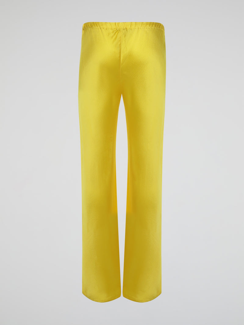 Step up your style game with these vibrant Yellow Drawstring Silk Trousers by Roberto Cavalli. Crafted from luxurious silk, these statement trousers offer a silky soft touch and a flowing silhouette that is both elegant and comfortable. Perfect for any occasion, let these eye-catching pants be the star of your ensemble.